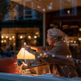 Shop owner switching off the lamp at closing time