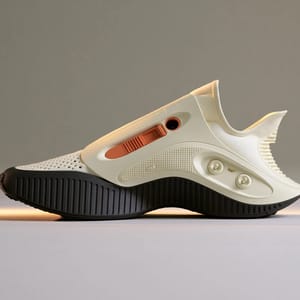A running shoe designed in the cassette futurism aesthetic, featuring ribbed cream plastic panels and orange slide-controls.