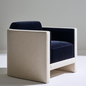 A modern minimalist armchair rendered in navy and cream against a clean, muted backdrop.