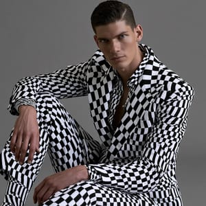 op art patterns on a tailored formal suit, mesmerizing high-contrast black and white geometric lines, optical illusion of swelling depth and kinetic motion, sharp tailoring, crisp hard-edge studio lighting, solid neutral gray background, avant-garde high-fashion editorial portrait, flawless graphic precision --ar 2:3 --style raw