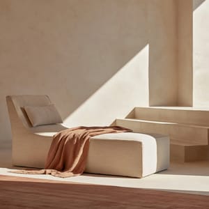 A minimalist modern living room featuring a linen lounge chair rendered in the quiet luxury aesthetic with soft directional key light.