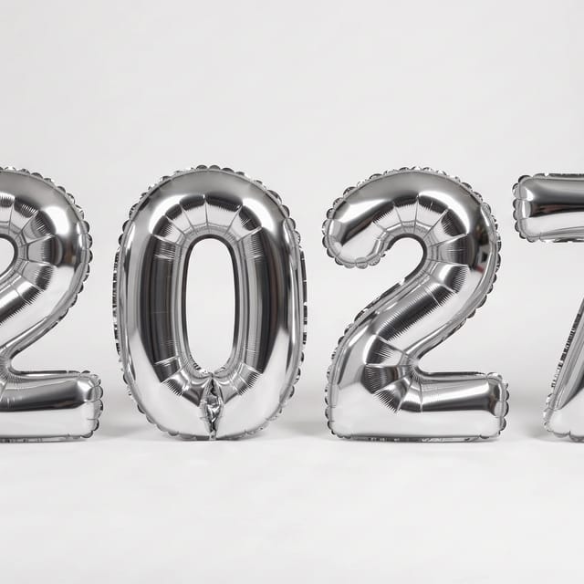 2027 as crinkled silver foil balloons on white