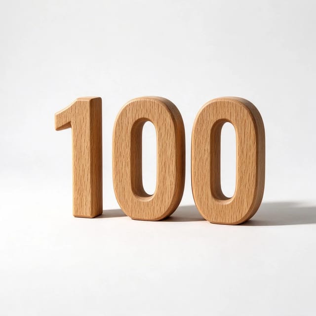 The number 100 cut from solid oak