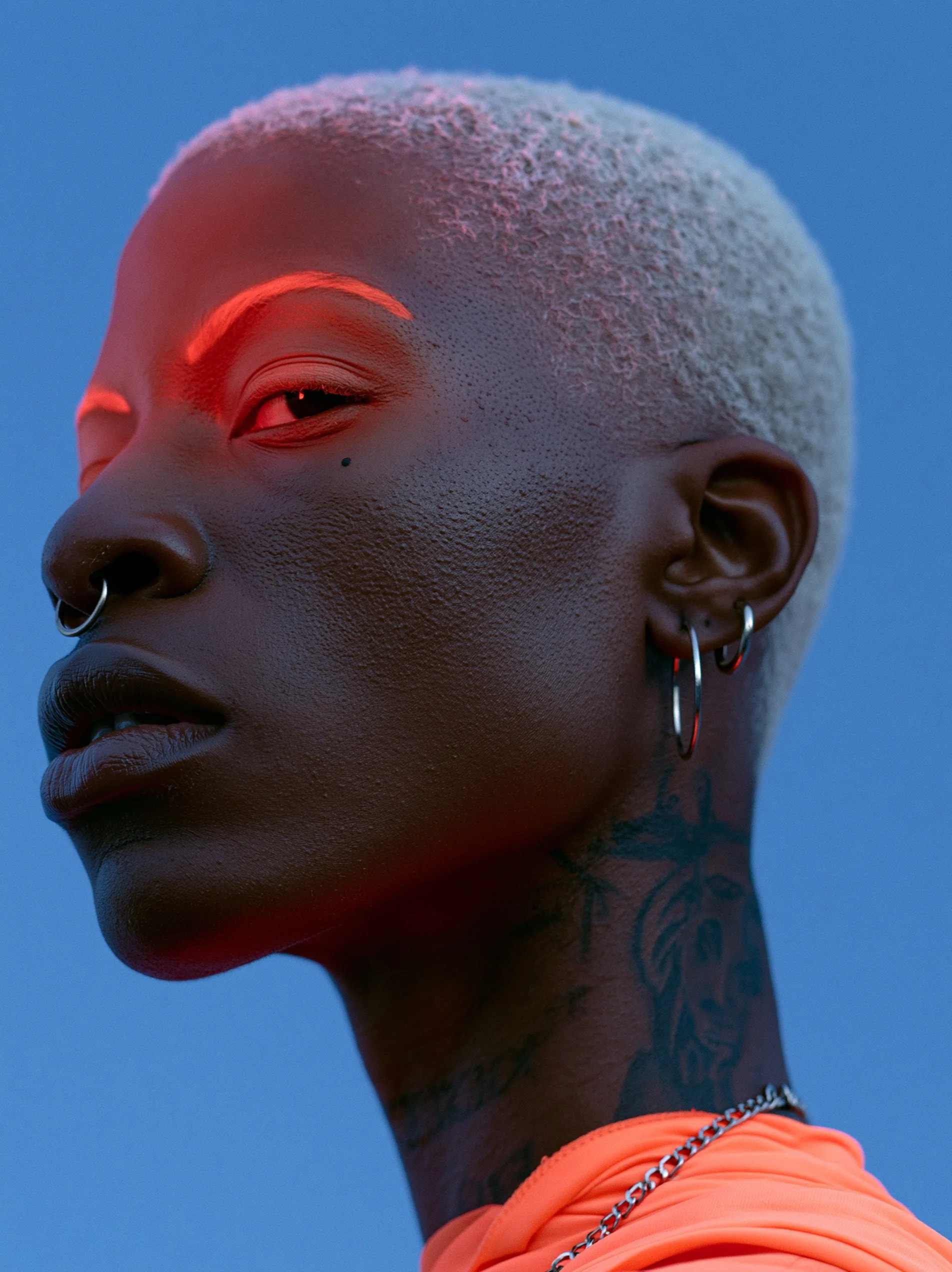 A cinematic portrait of a regal tech-enhanced warrior designed with the vibrant colors and sleek cybernetics of afrofuturism.