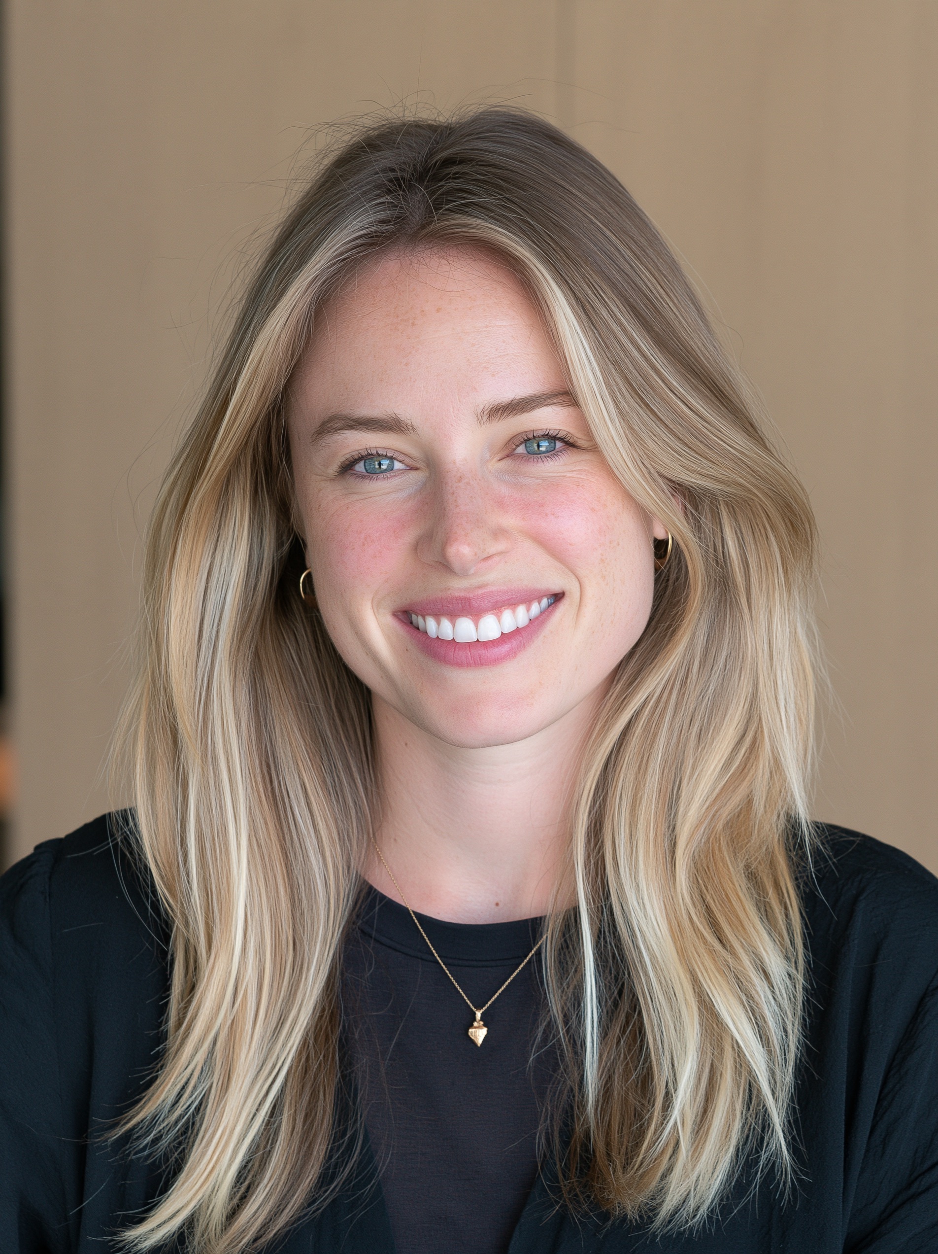 A head shot of a woman, with her face and shoulders filling the frame.