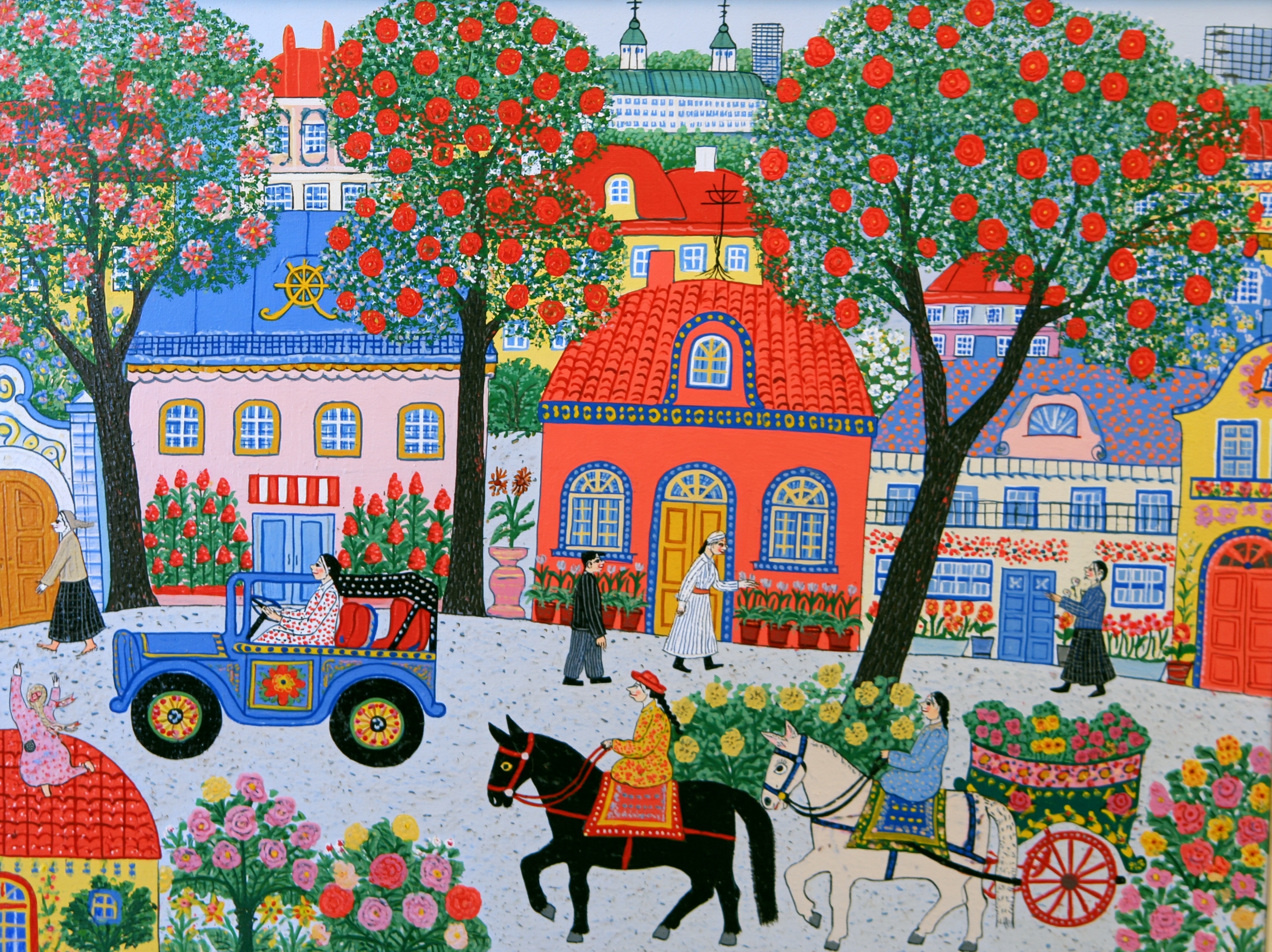 Colorful naive art painting depicting a vibrant town street with blooming trees, a vintage blue car, pedestrians, and horse riders.